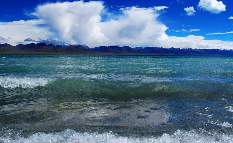 Blue lake with mountains in background
