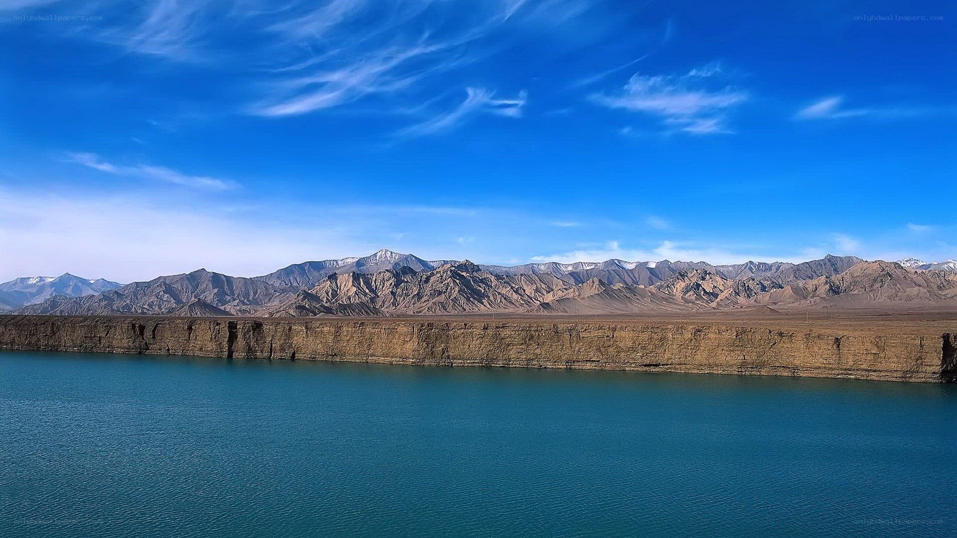 Blue lake with mountains in background