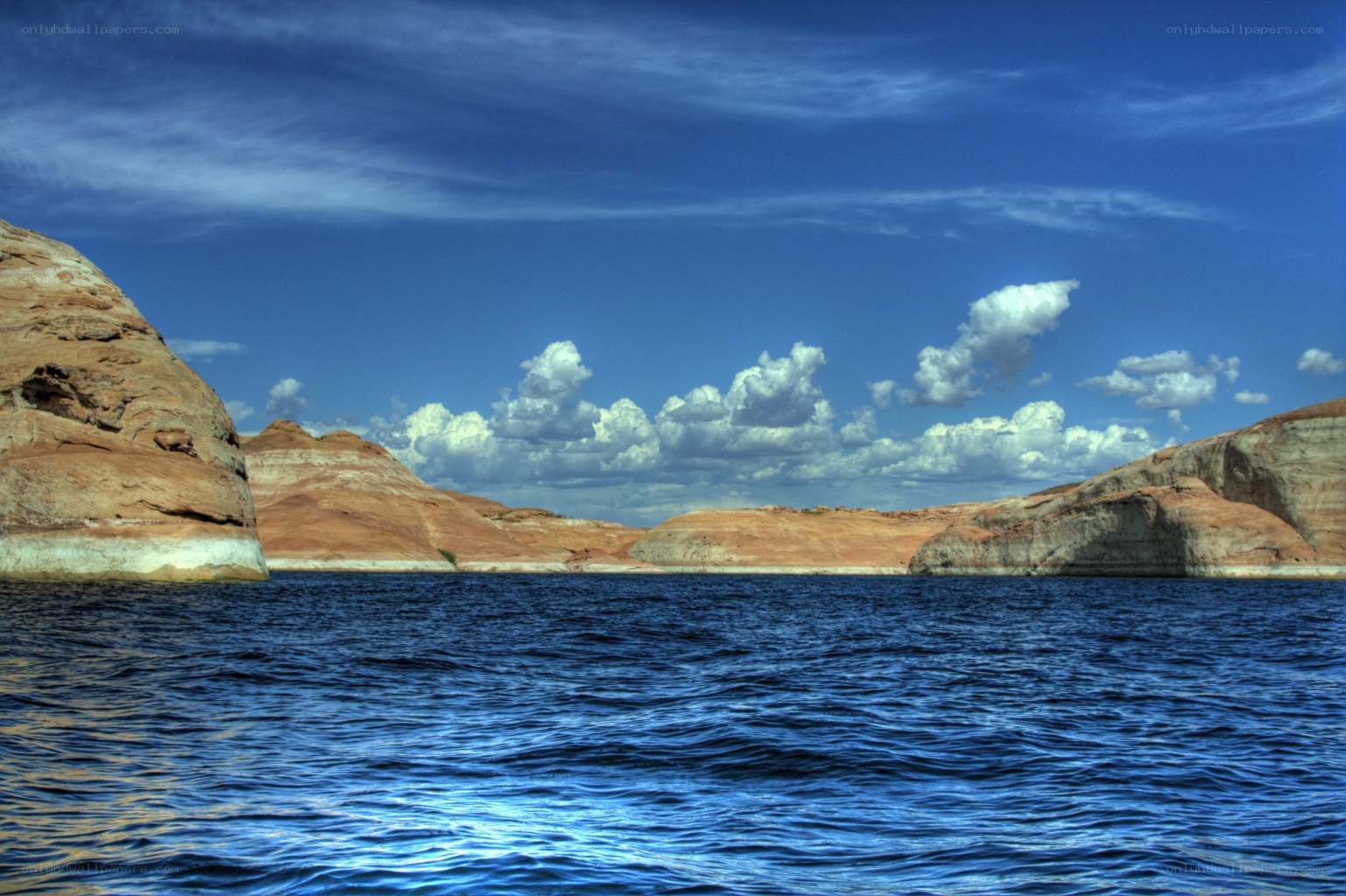 Blue lake with rock formations