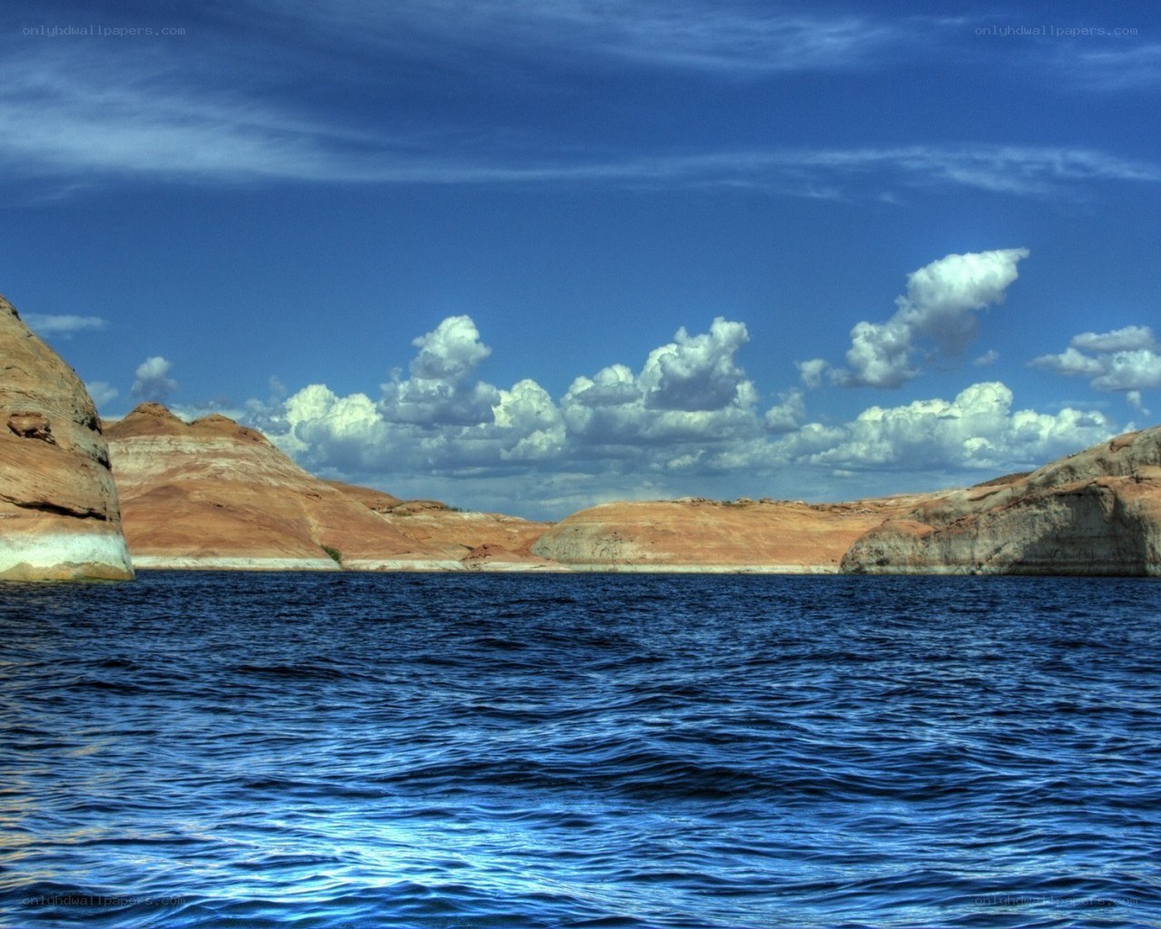 Blue lake with rock formations