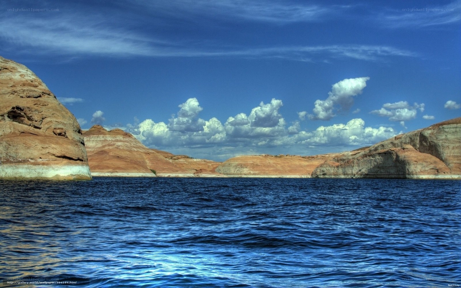 Blue lake with rock formations