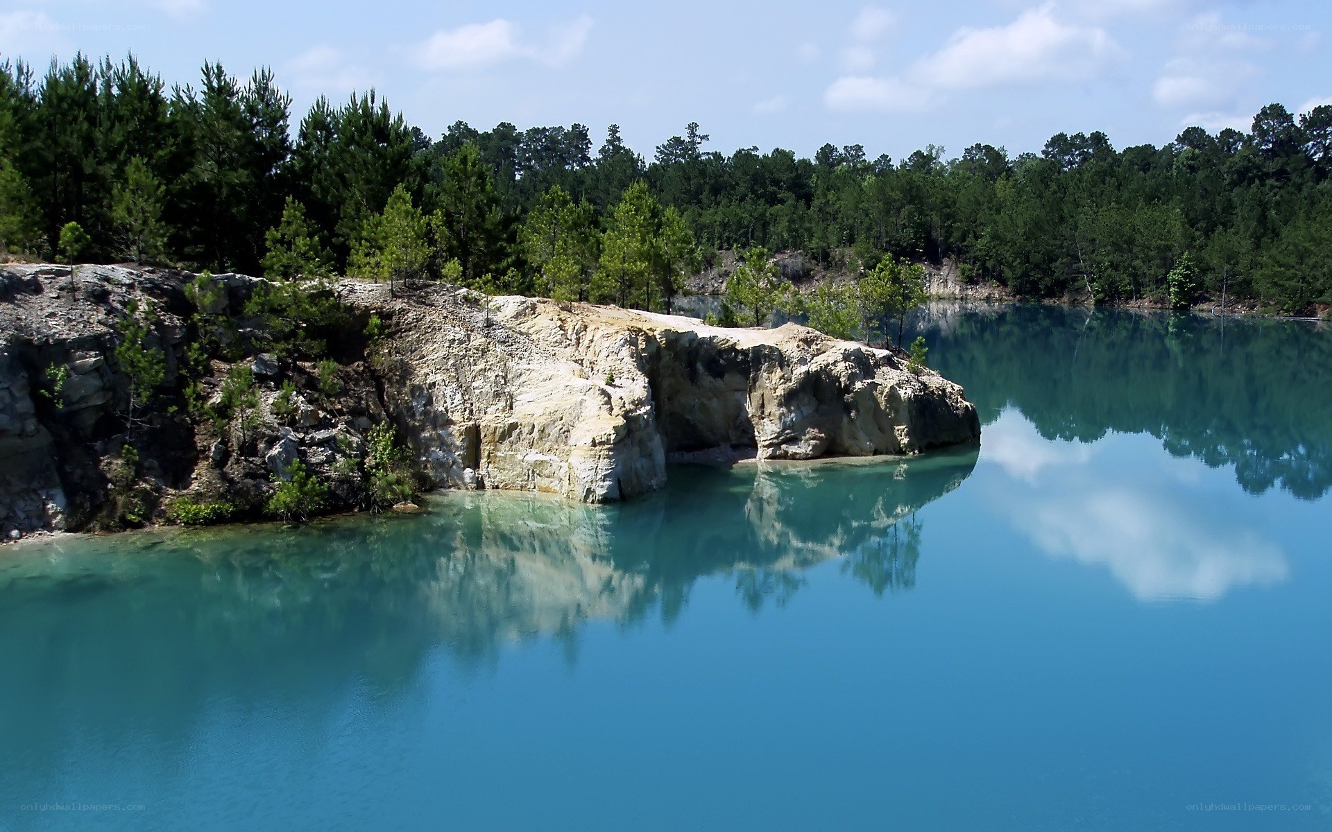 Blue lake with rocky cliff