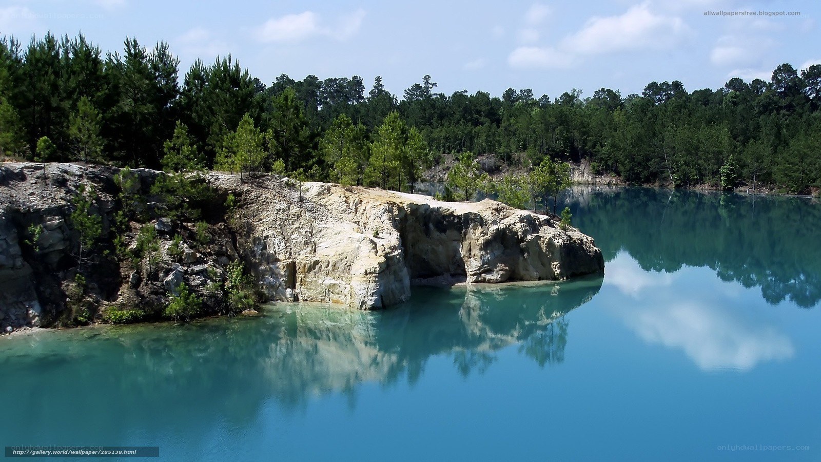 Blue lake with rocky cliff