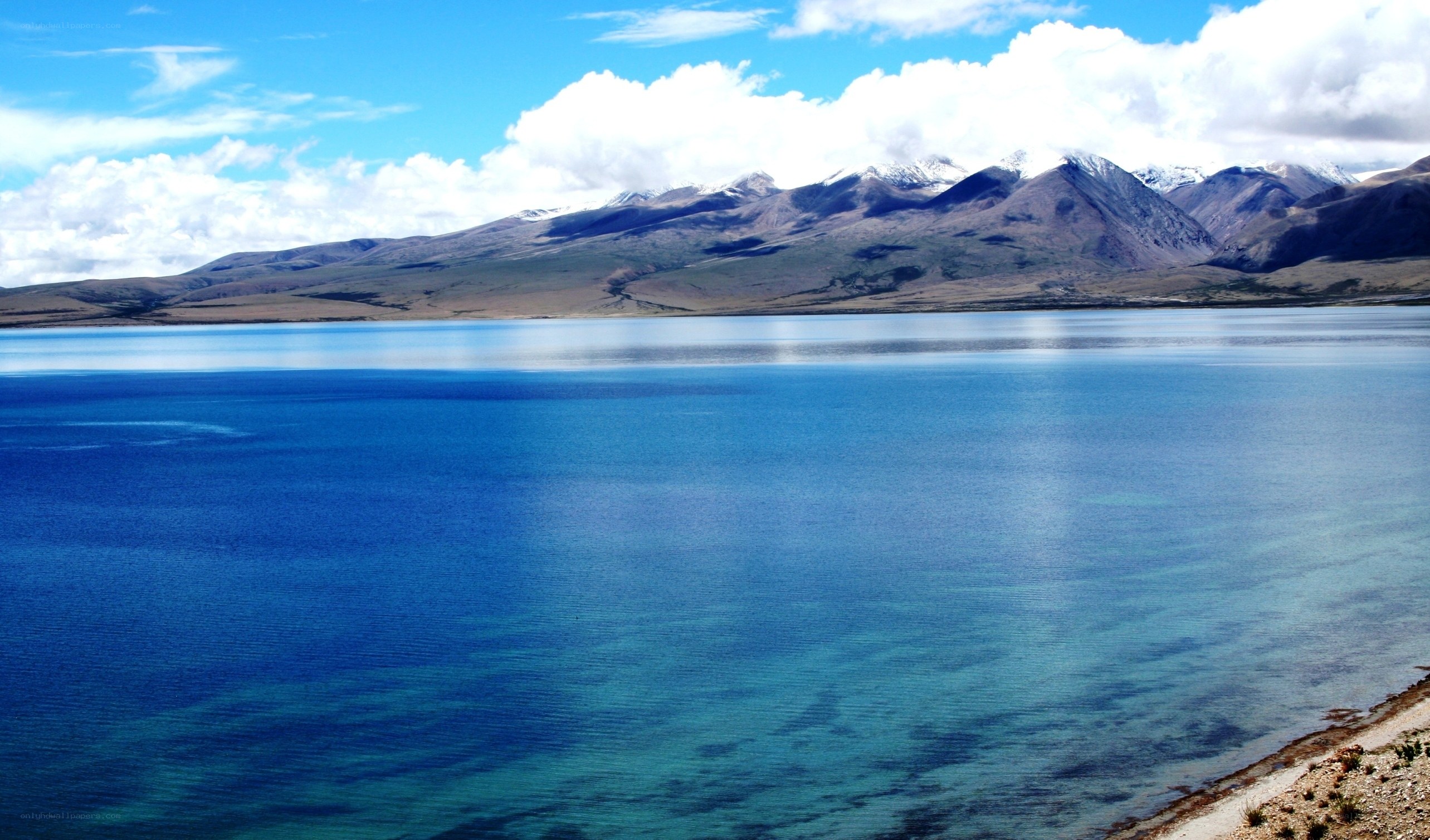 Blue lake with snow-capped mountains