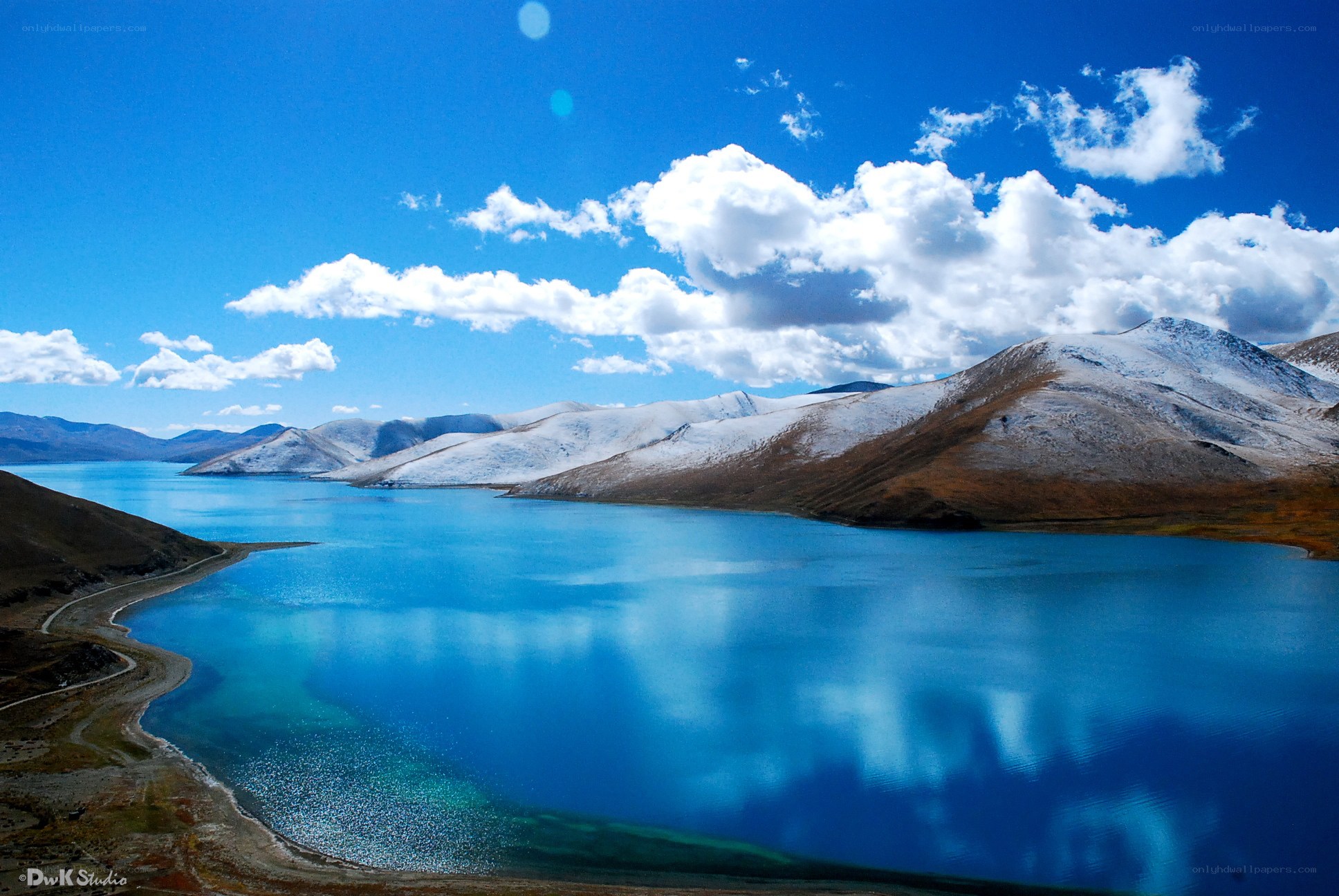 Blue lake with snow-capped mountains