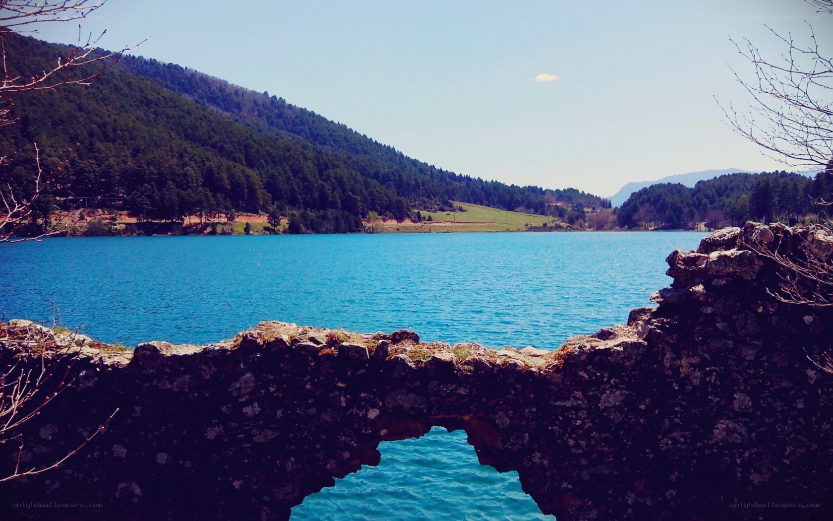 Blue lake with stone arch