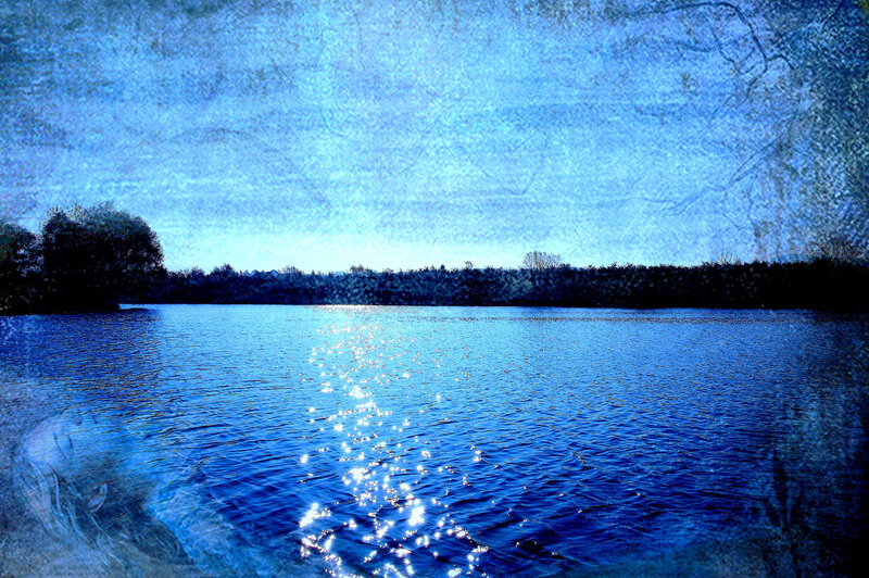 Blue lake with sun reflection