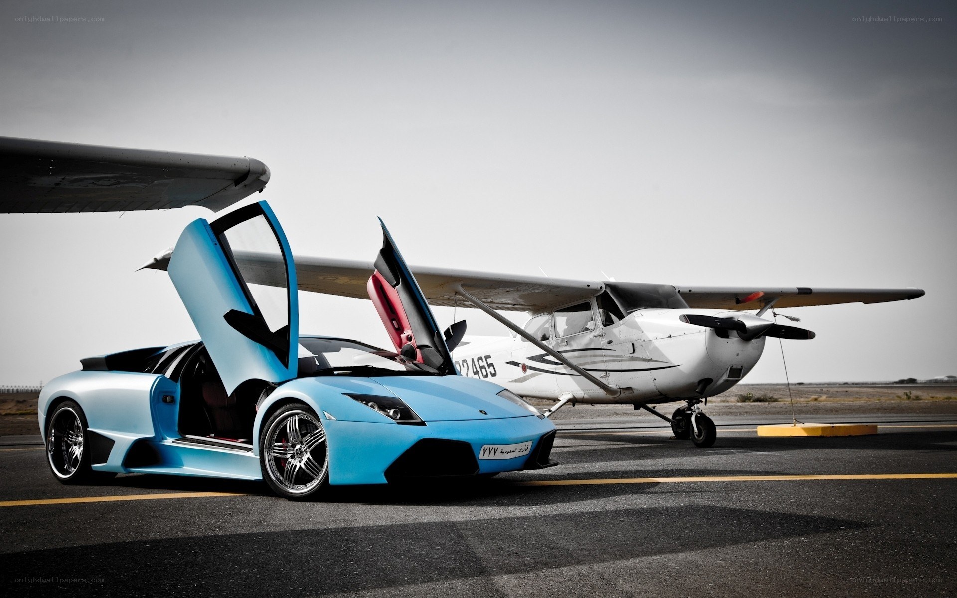 Blue Lamborghini and airplane