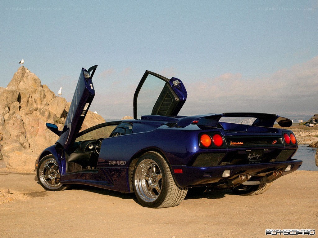 Blue Lamborghini Diablo on beach