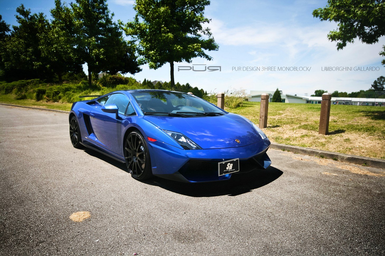 Blue Lamborghini Gallardo on road