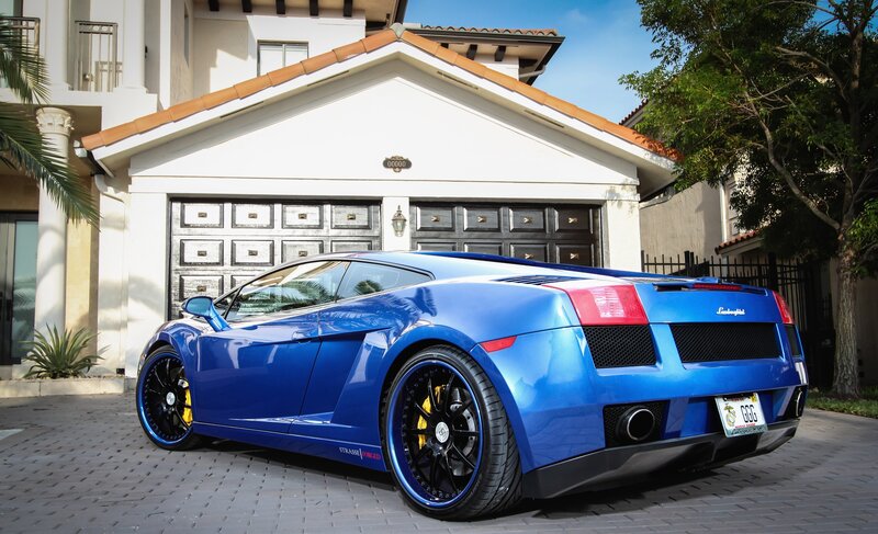 Blue Lamborghini in driveway