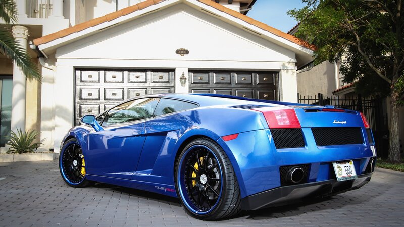 Blue Lamborghini in driveway