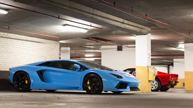 Blue Lamborghini in parking garage