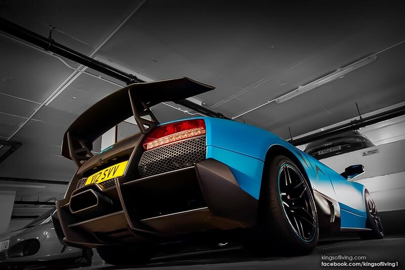 Blue Lamborghini in parking garage