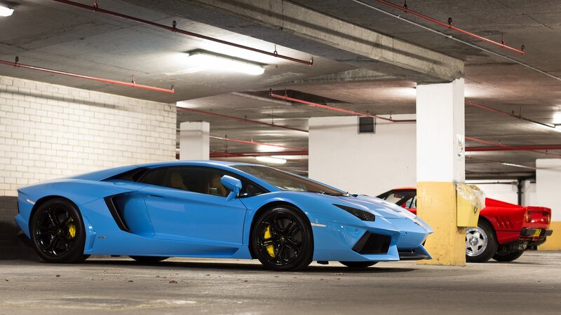 Blue Lamborghini in parking garage