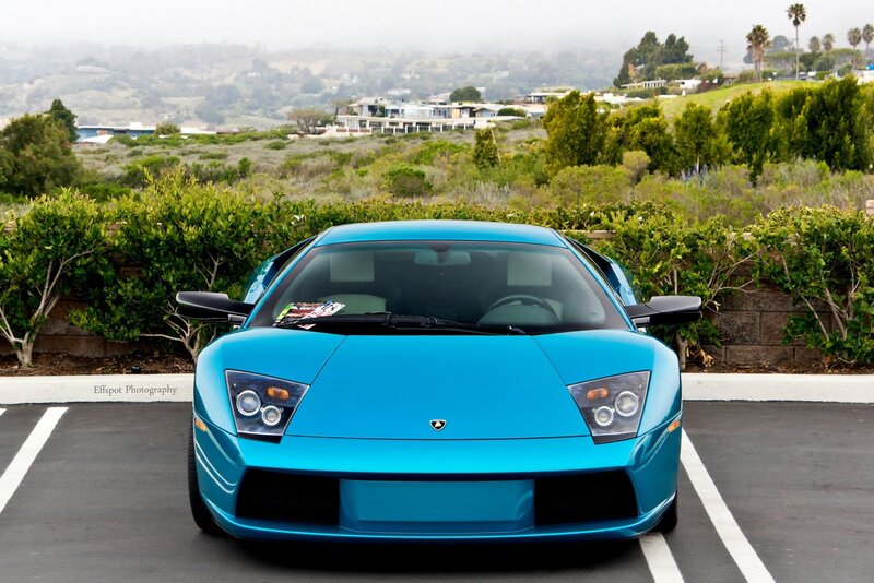 blue lamborghini in parking lot