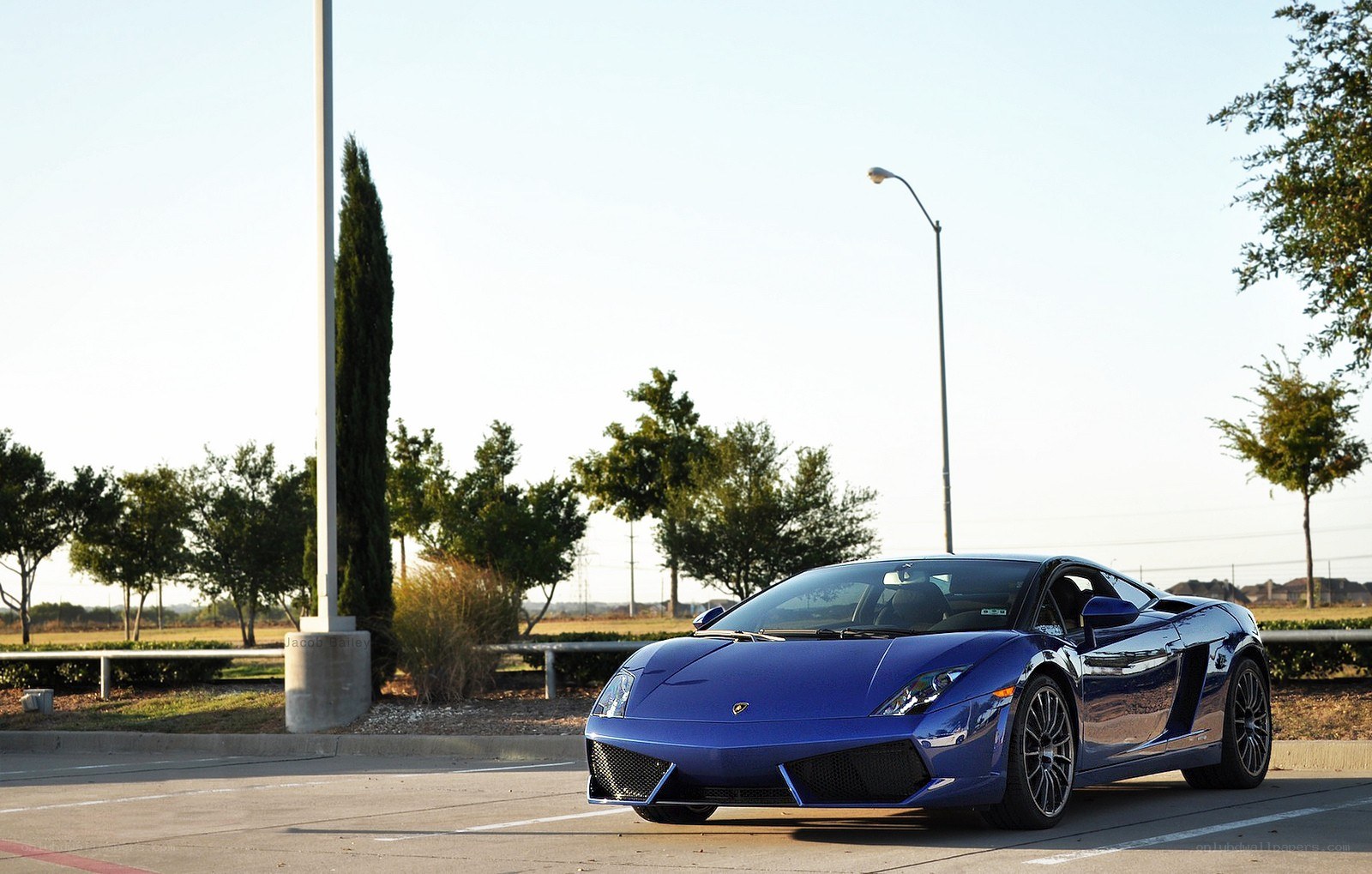 Blue Lamborghini in parking lot