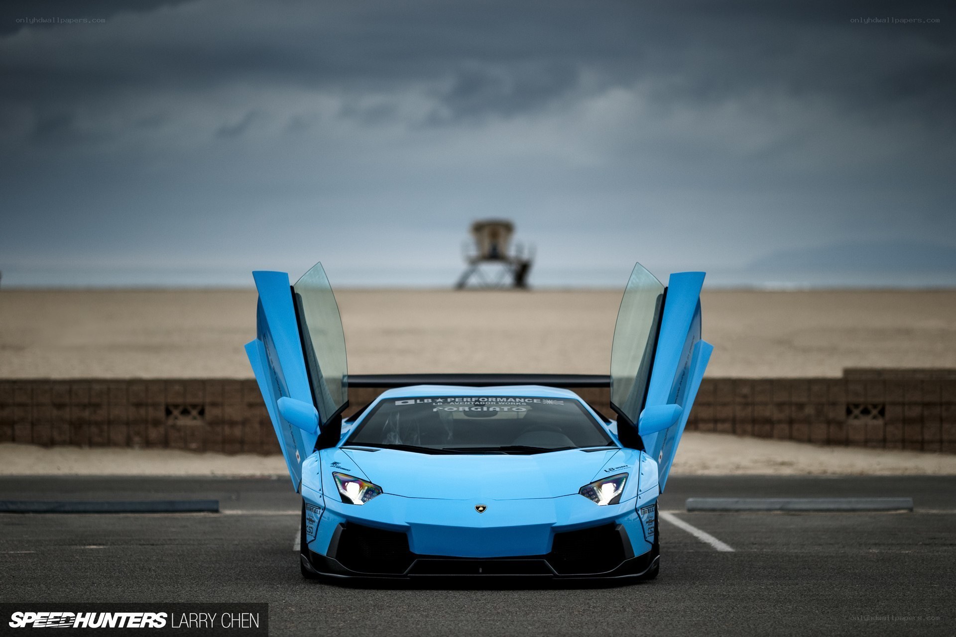 Blue Lamborghini on beach