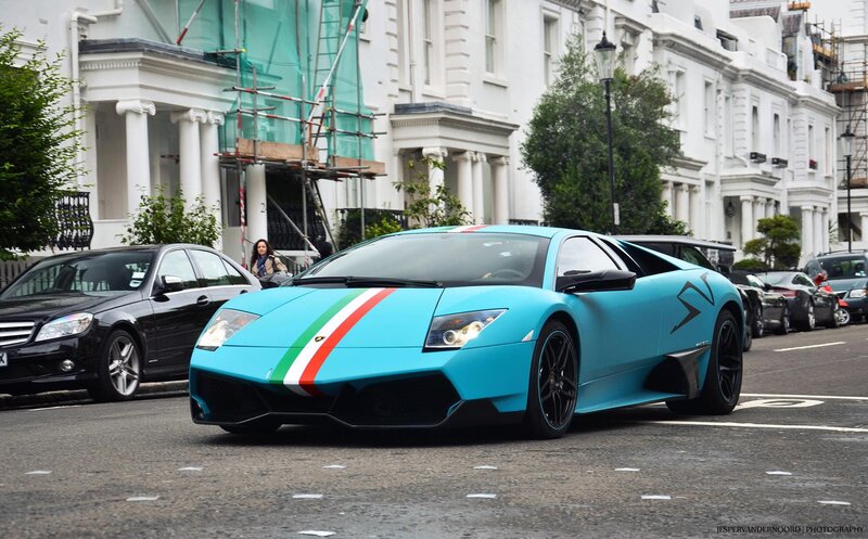Blue Lamborghini on city street