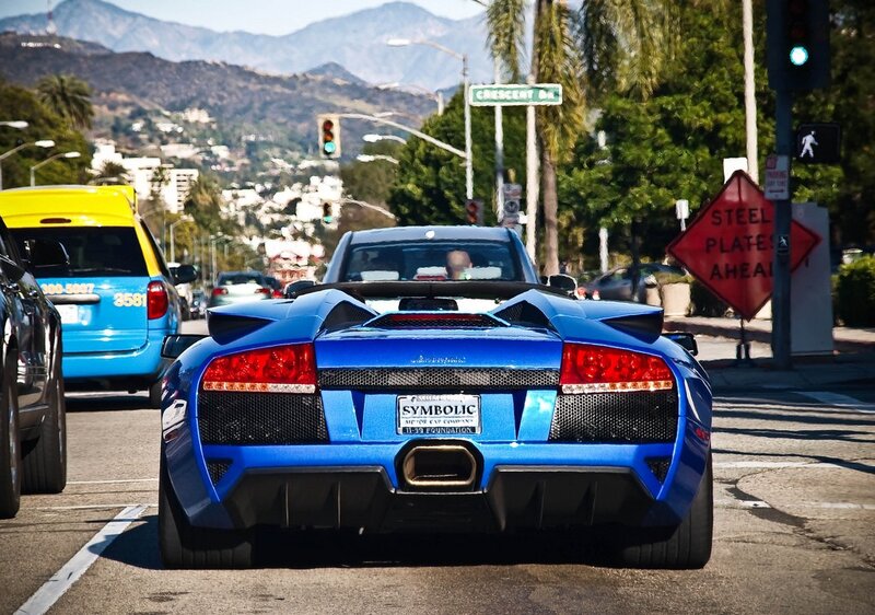 Blue Lamborghini on city street