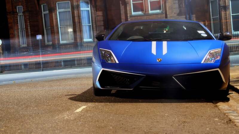 Blue Lamborghini on city street