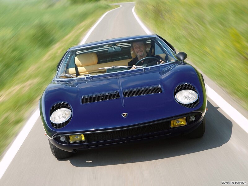 blue lamborghini on country road