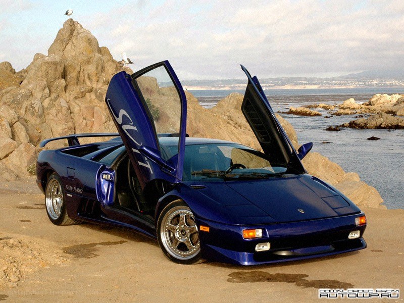 Blue Lamborghini on the beach
