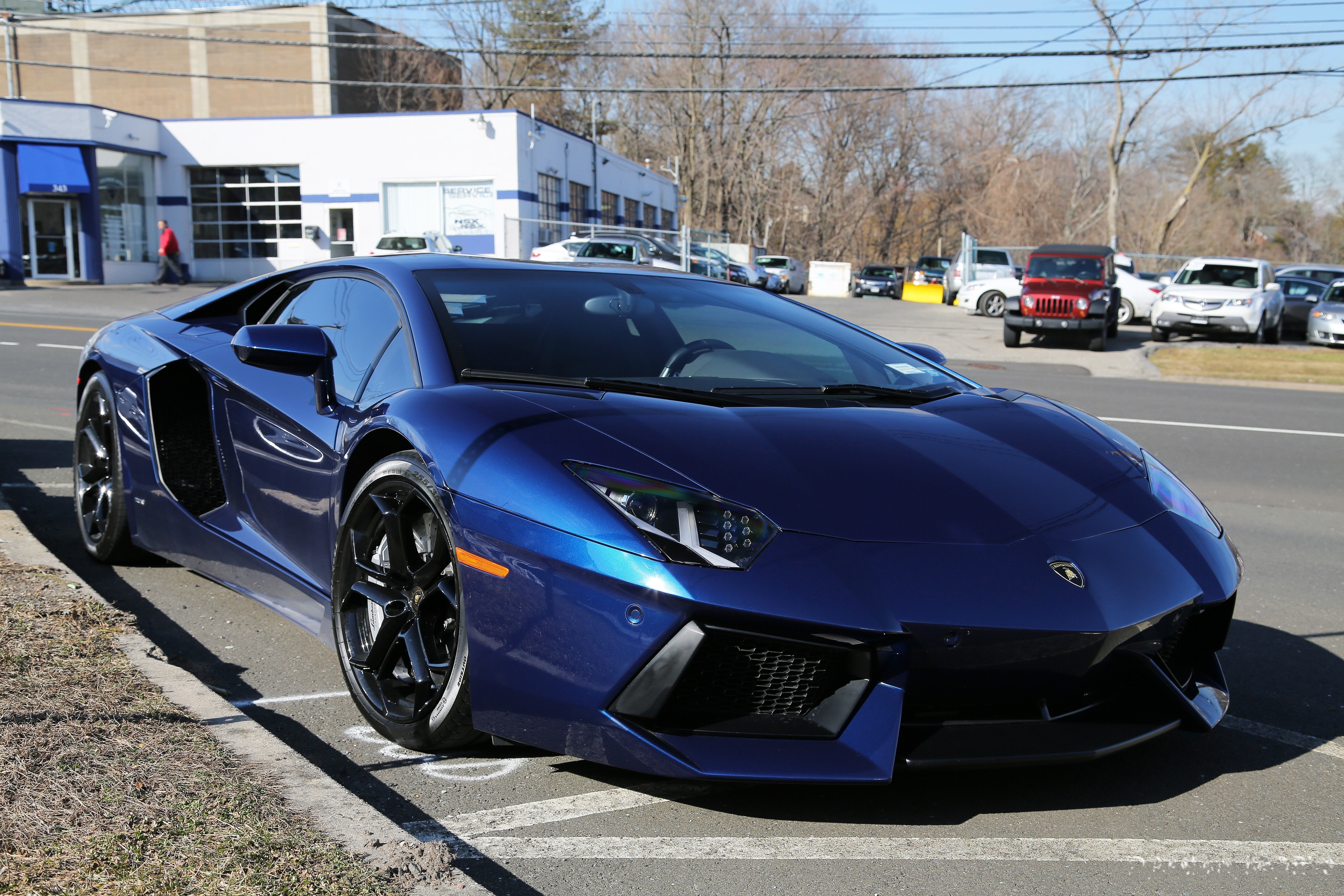 Blue Lamborghini parked on street