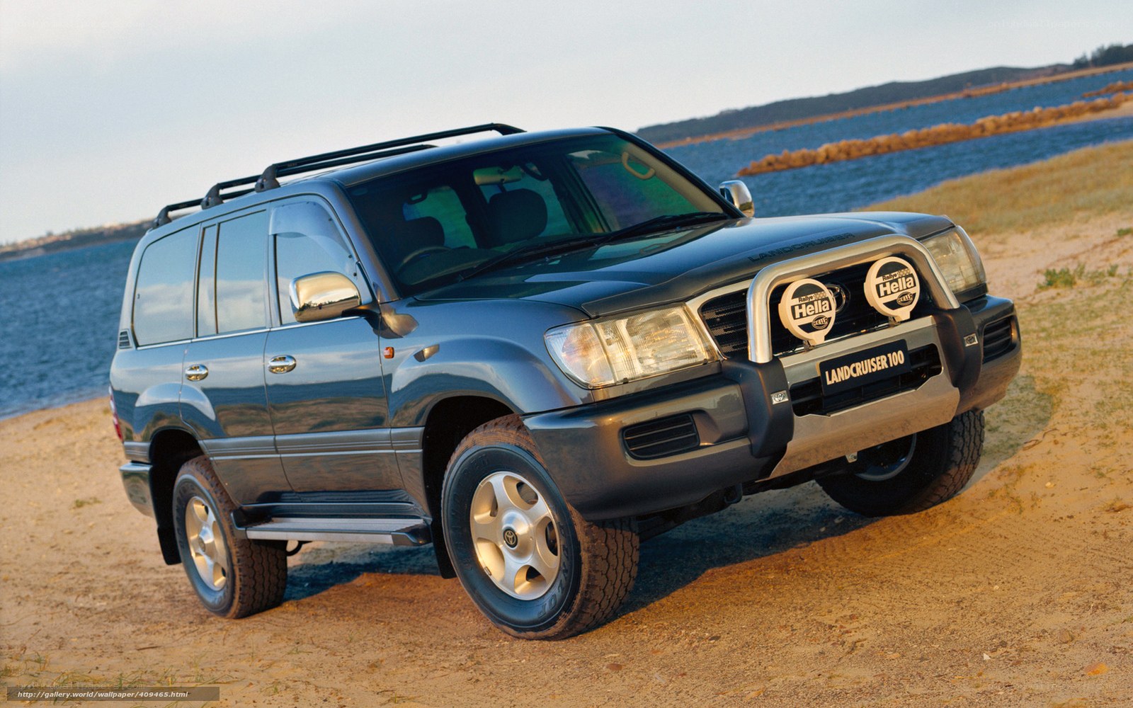 Blue Land Cruiser on beach