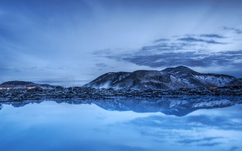 Blue landscape with mountain reflection