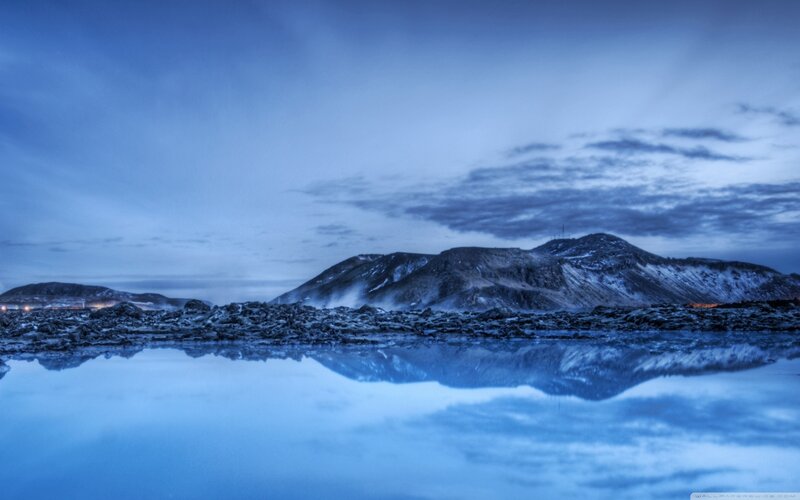 Blue landscape with mountain reflection