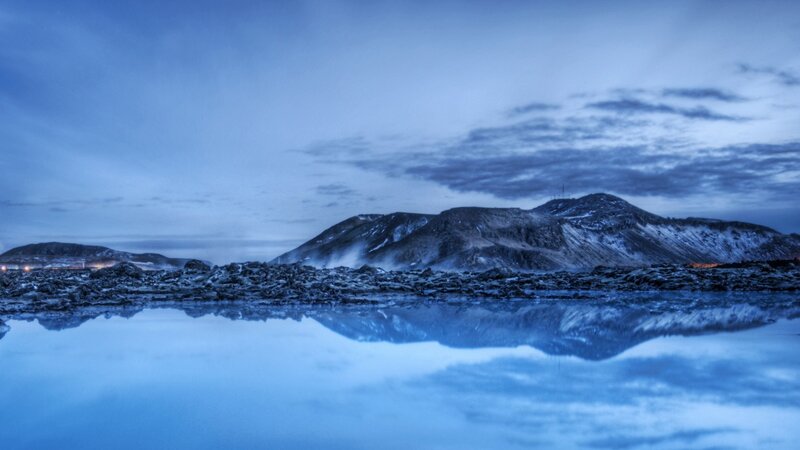 Blue landscape with mountain reflection