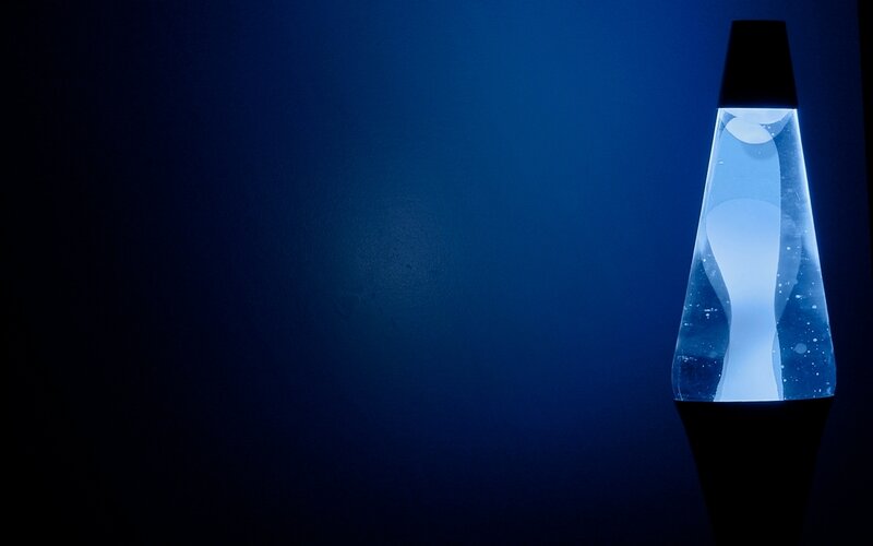 Blue lava lamp in dark room