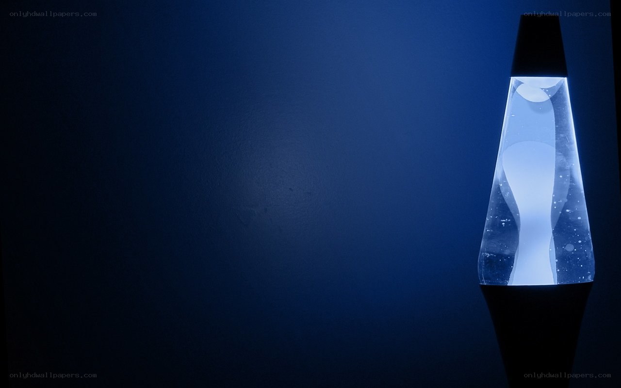 Blue lava lamp in dark room