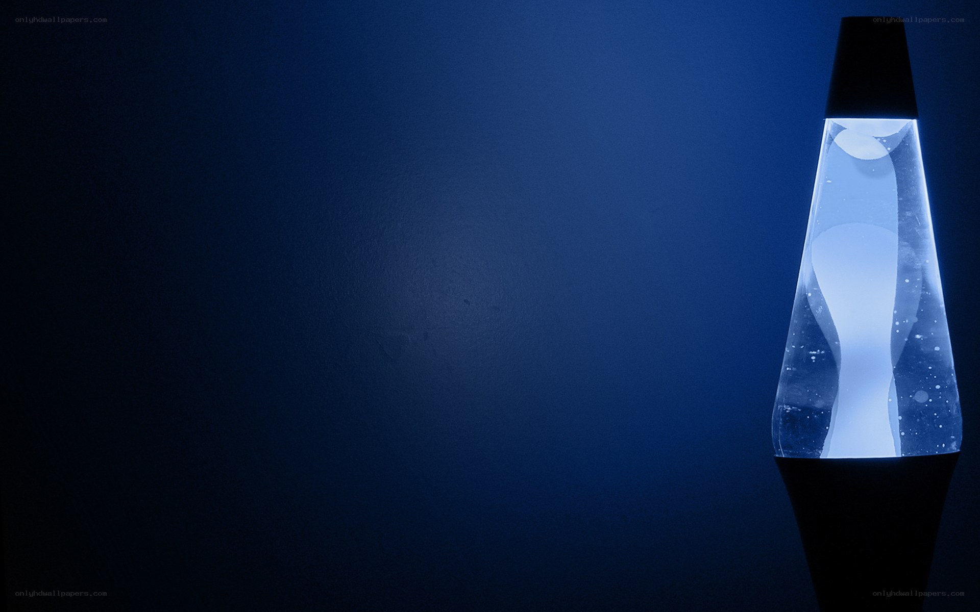 Blue lava lamp on dark background