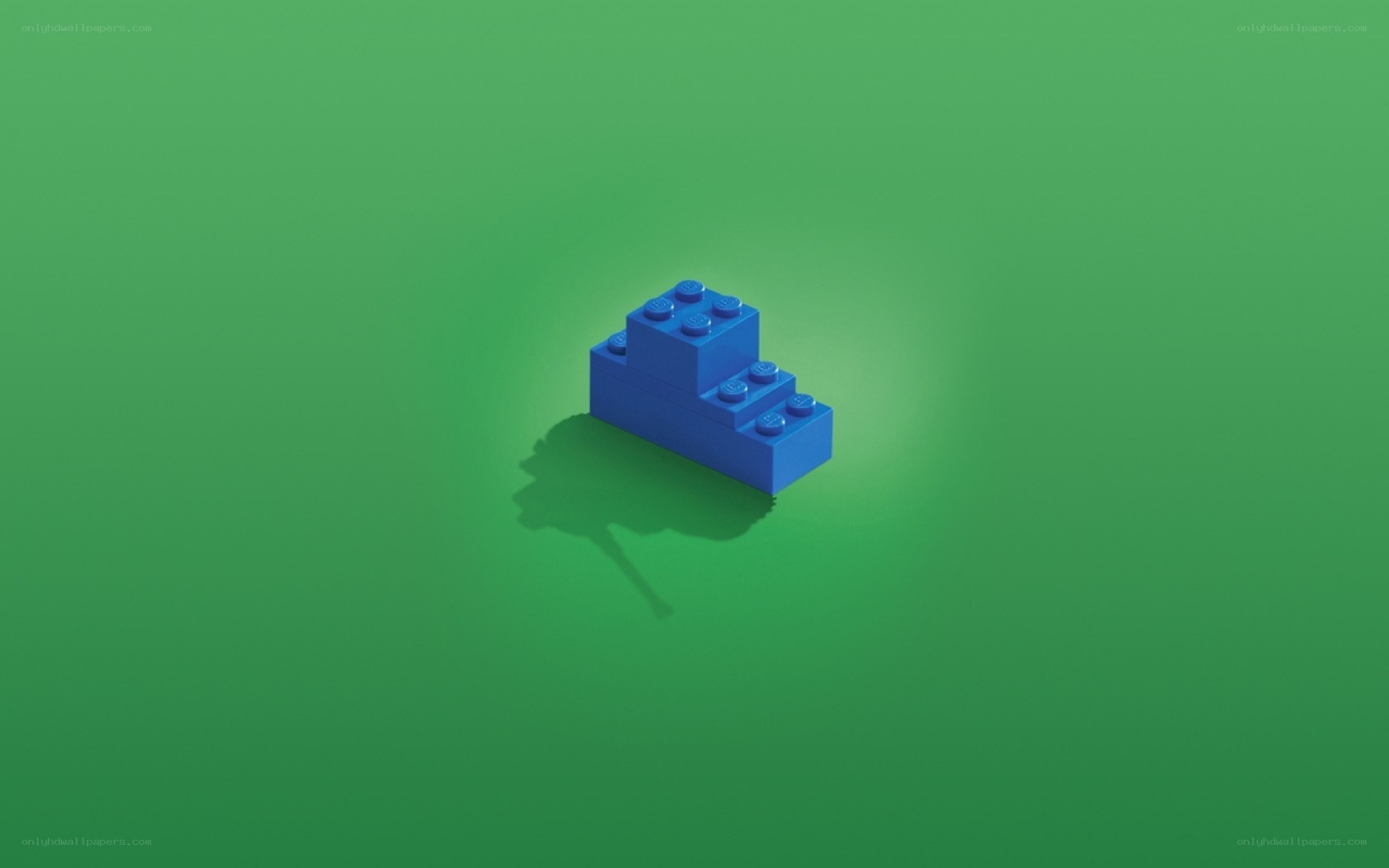 blue lego block on green