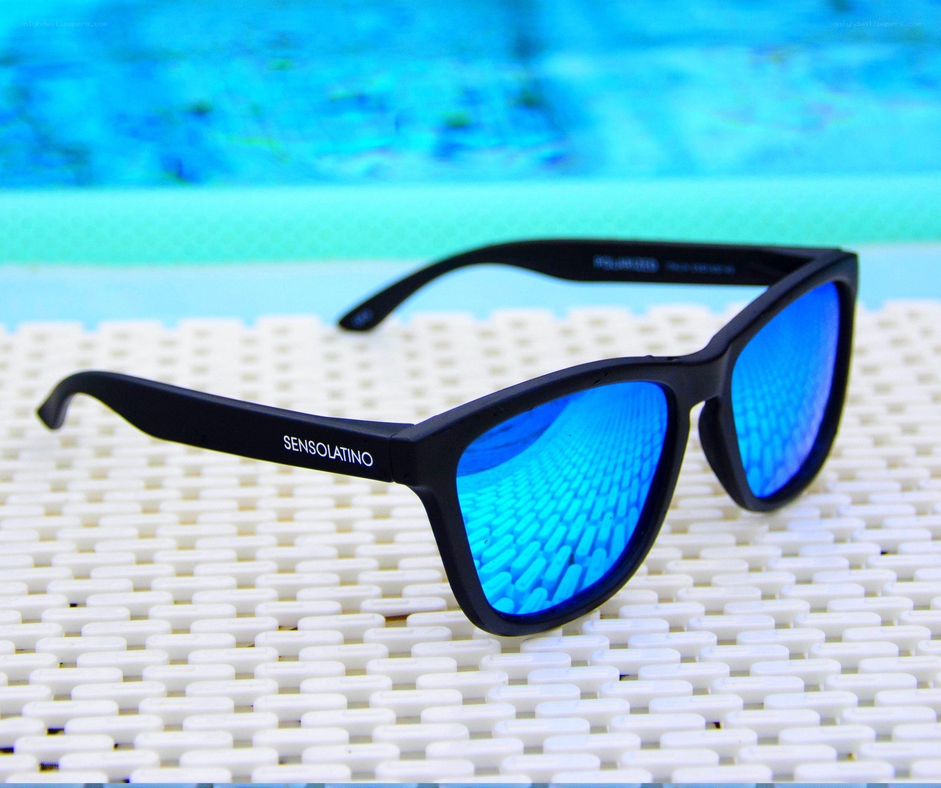 blue lens sunglasses by pool