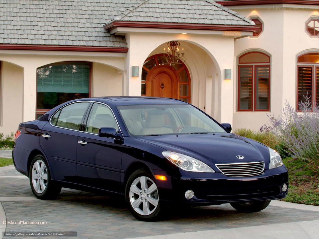 Blue Lexus ES sedan in front of house