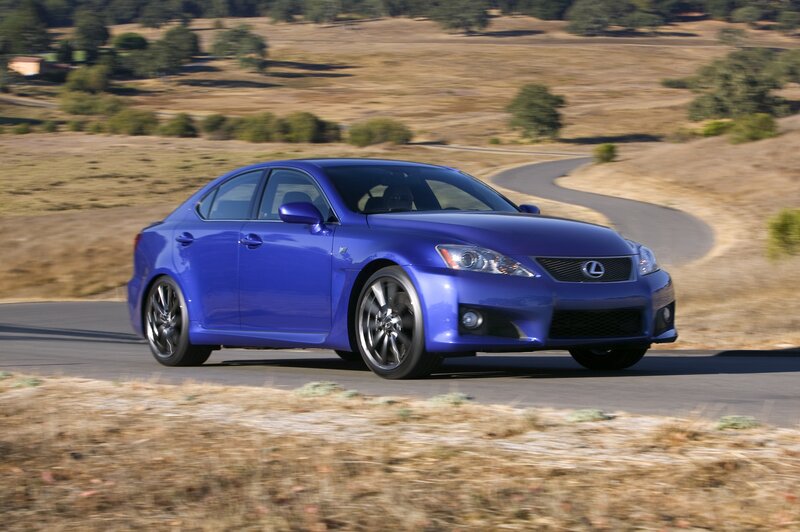 blue lexus is f on a winding road