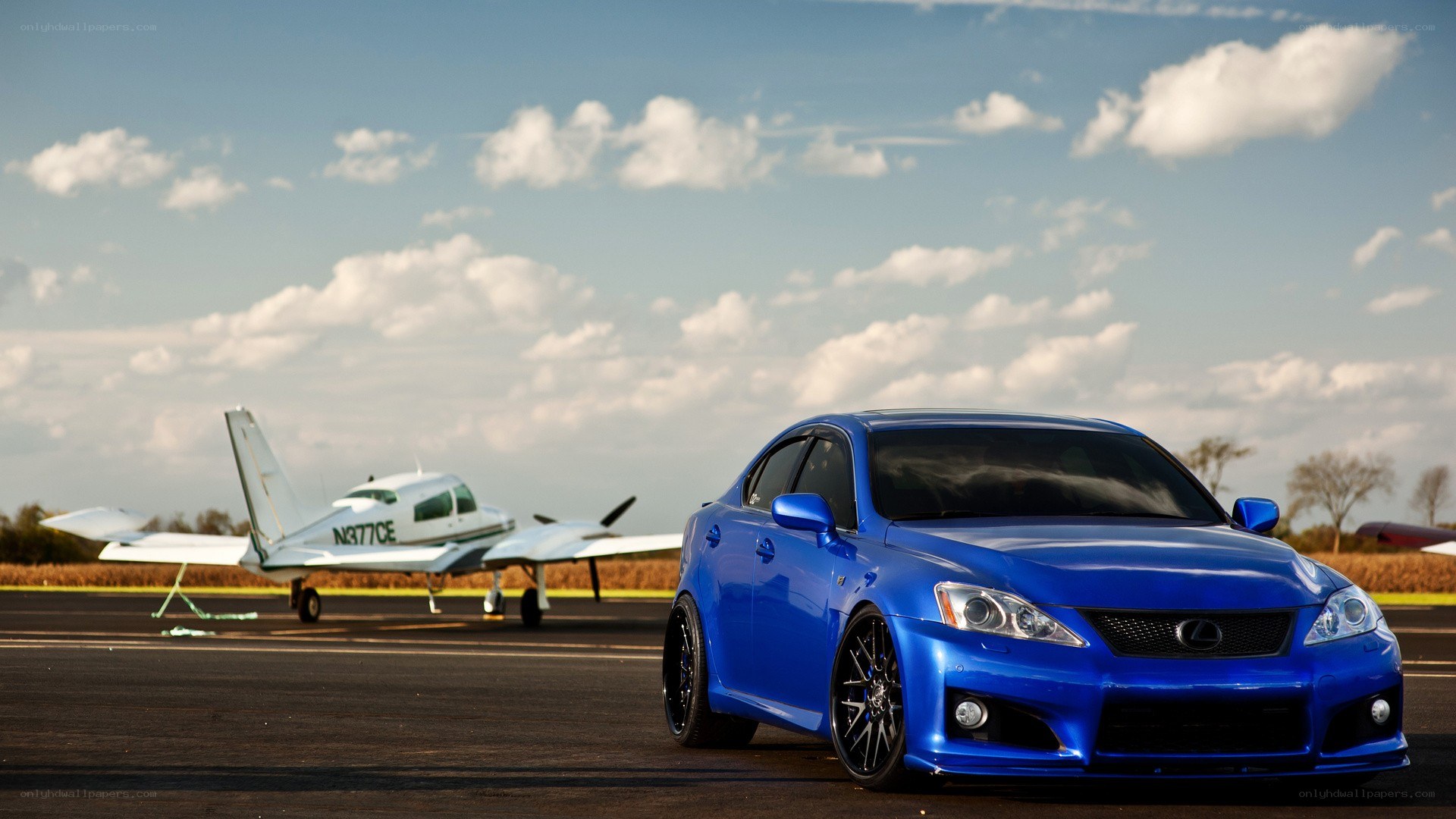 Blue Lexus on an airfield