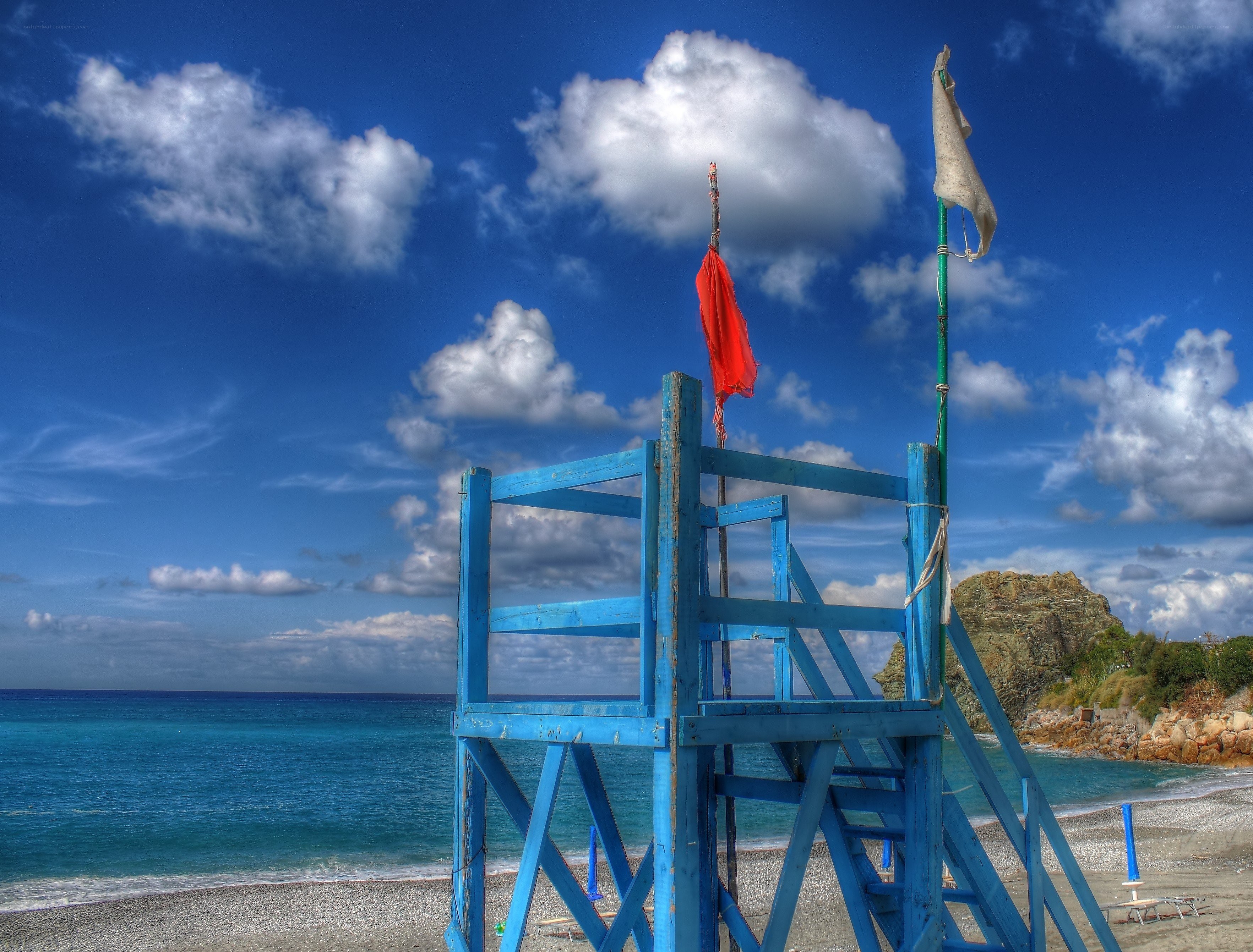 Blue lifeguard tower on beach