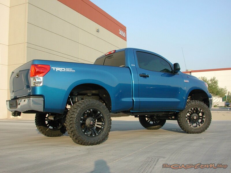 Blue Lifted Pickup Truck — Neutral, Afternoon