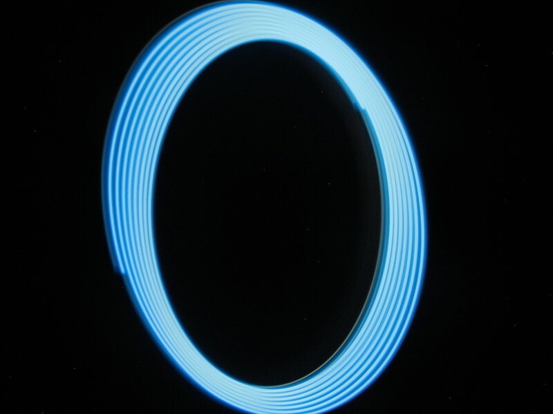 blue light circle on black