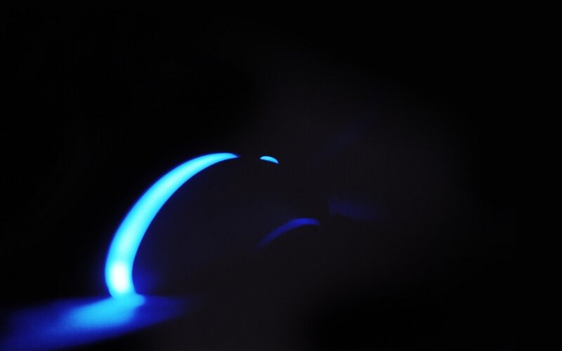 blue light curve on dark background