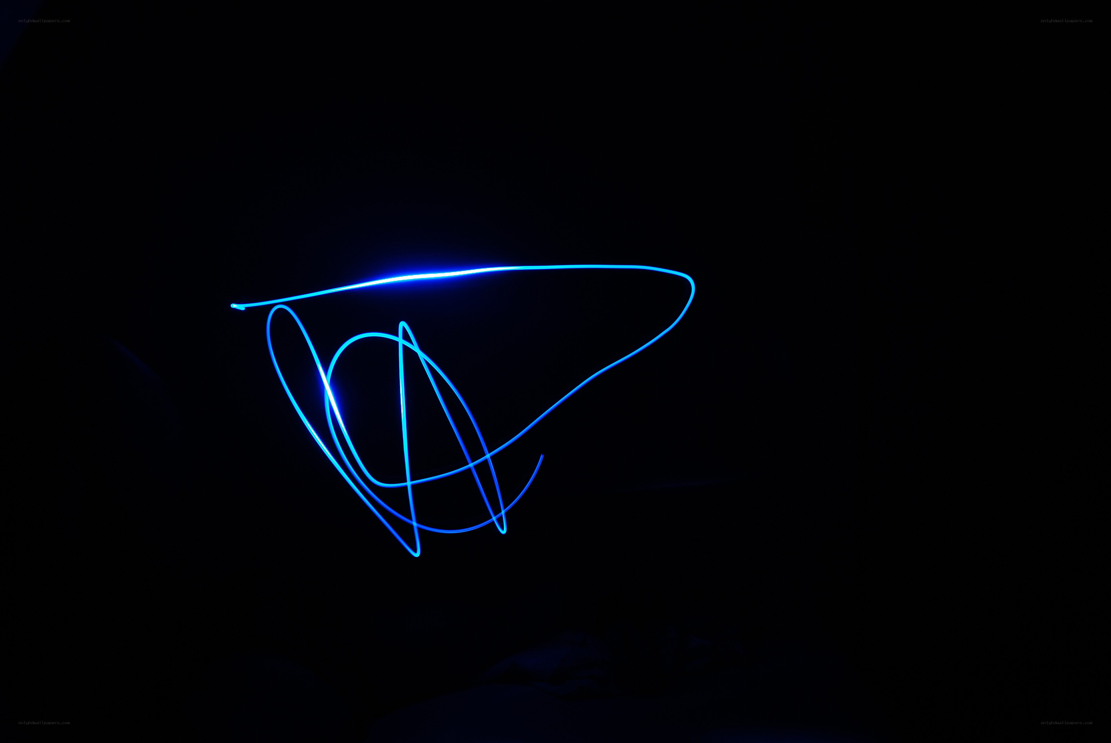 blue light drawing in darkness