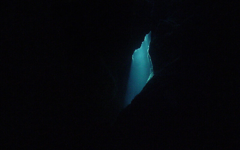 blue light in dark cave