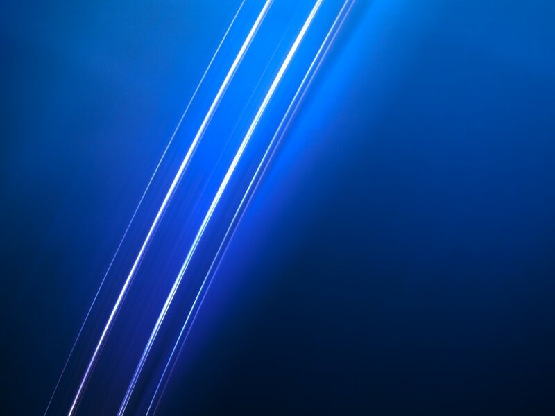 Blue light streaks on dark background
