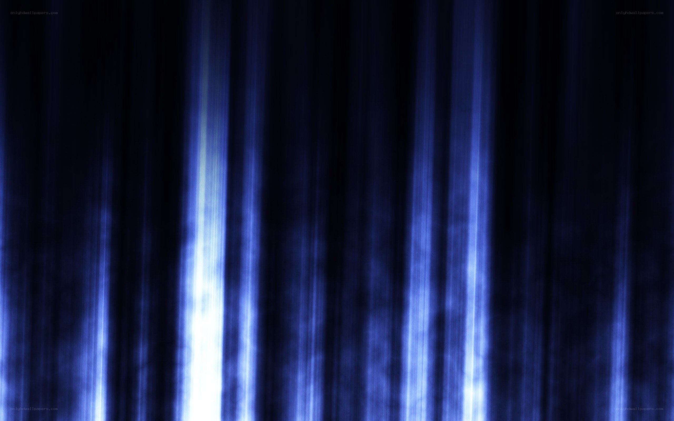 blue light streaks on dark background