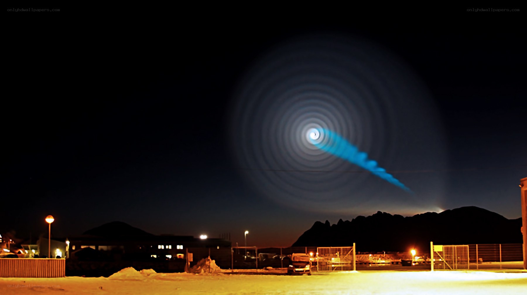 Blue light trail in night sky