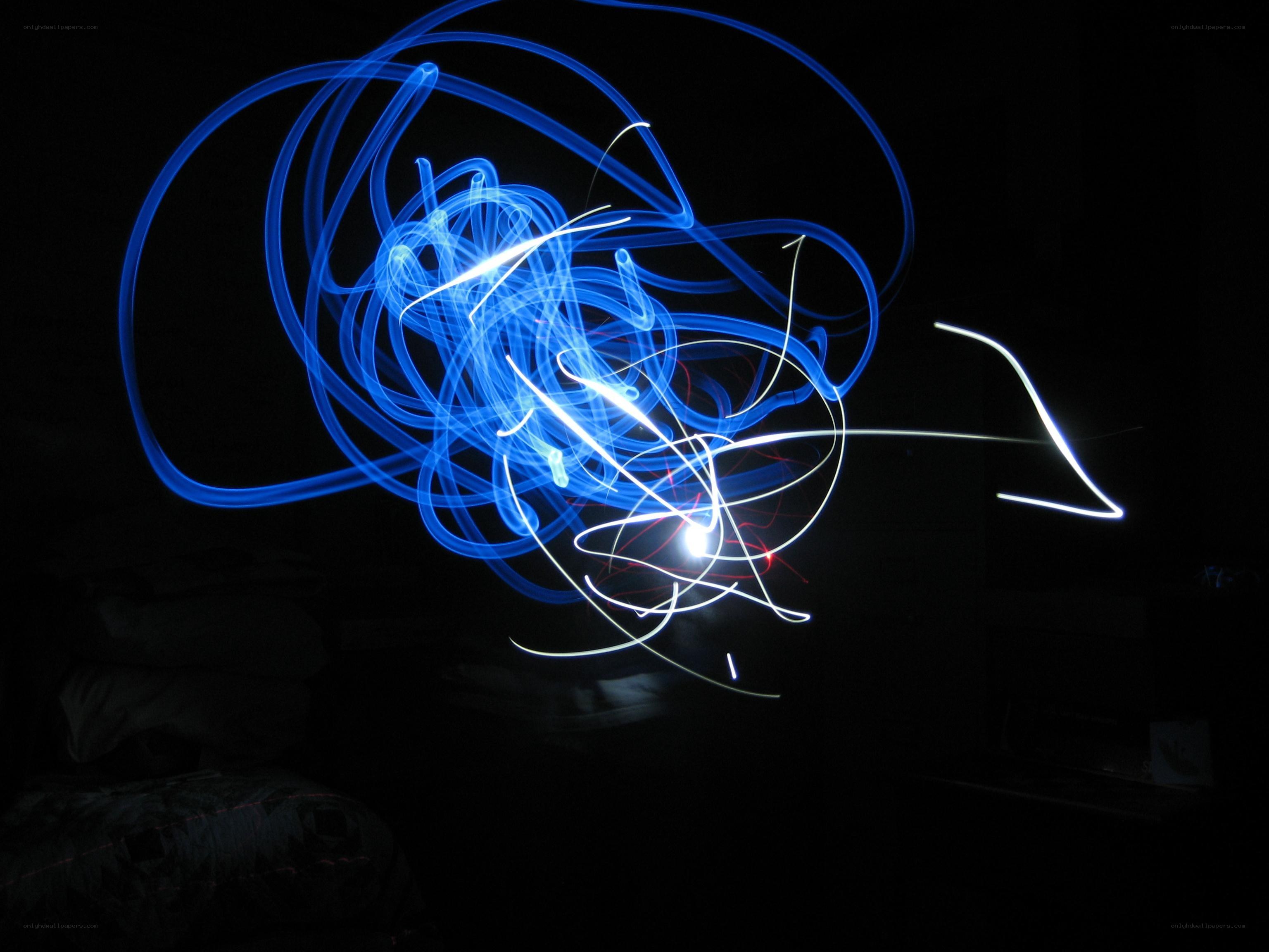Blue light trails in darkness